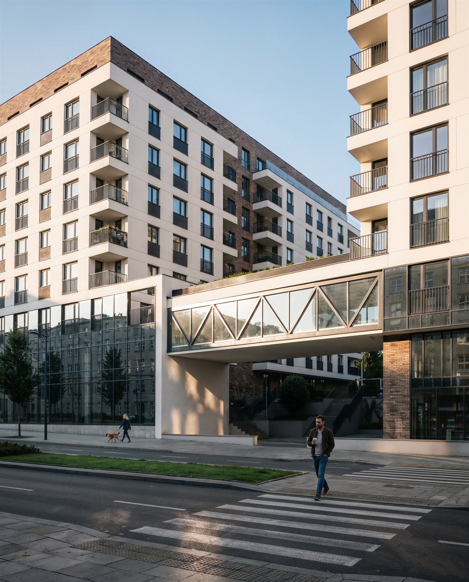 Glazed skybridge spanning the street above a pedestrian crossing