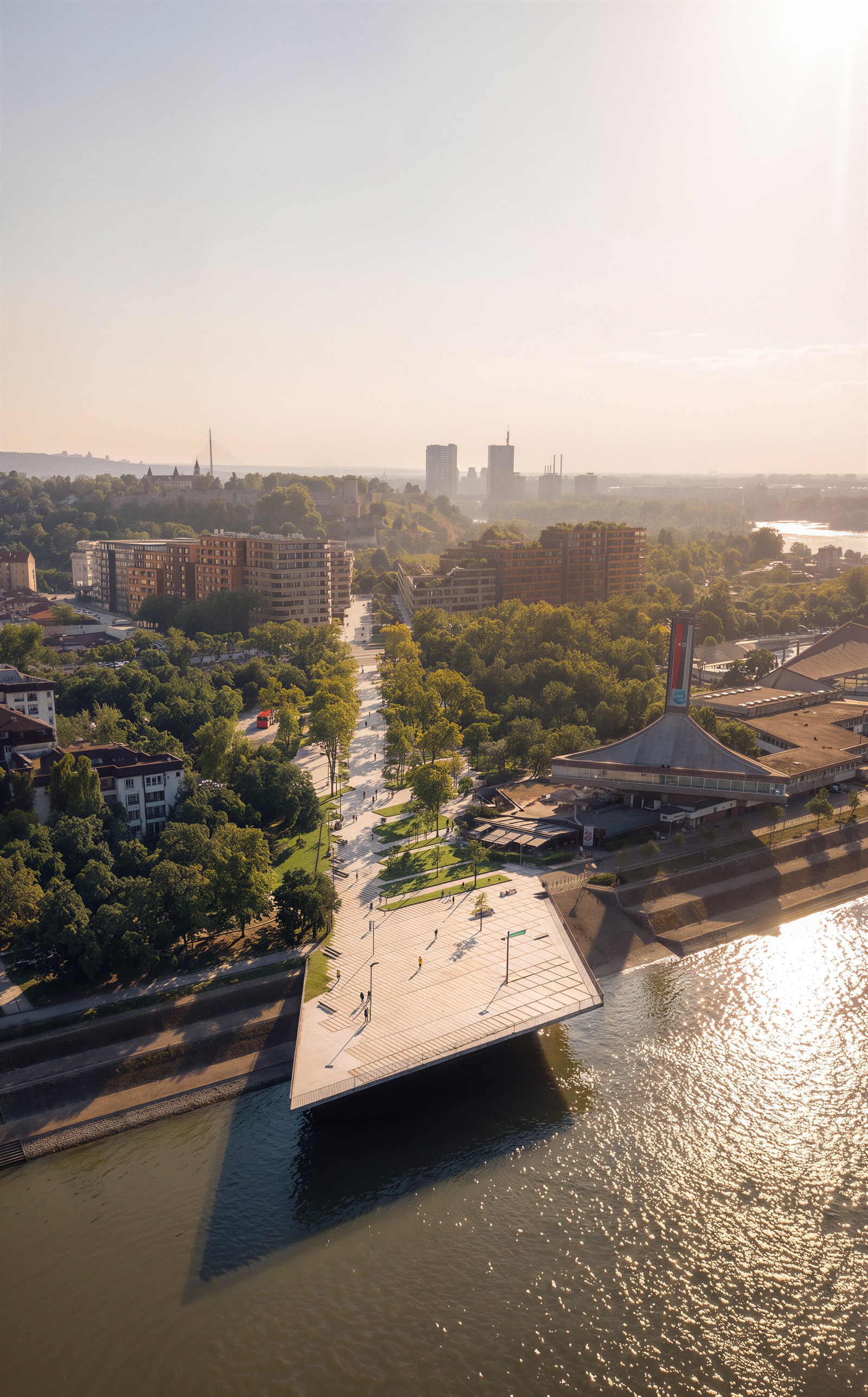 Cantilevered river plaza over the water with promenade axis
