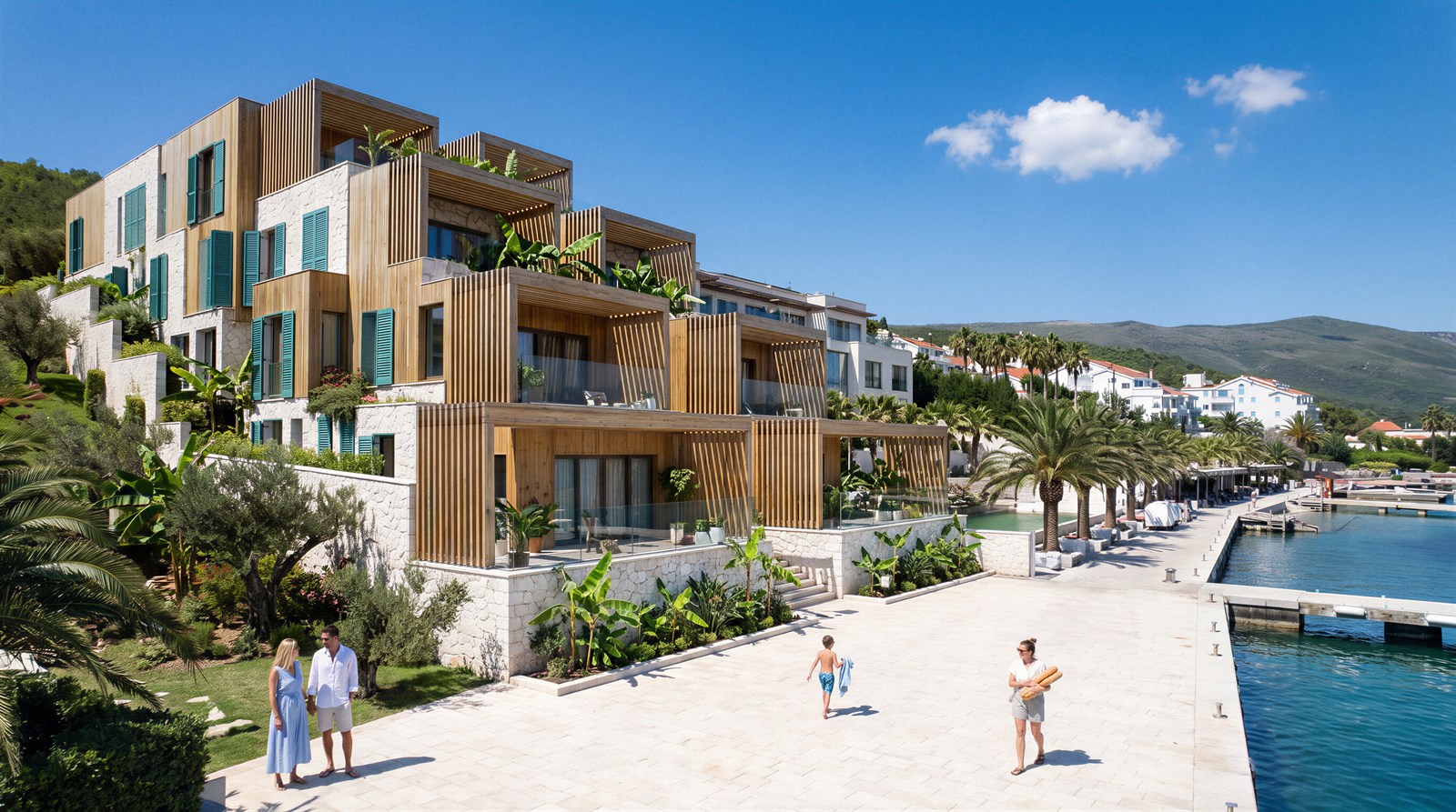 Villas above the marina promenade under a deep blue sky