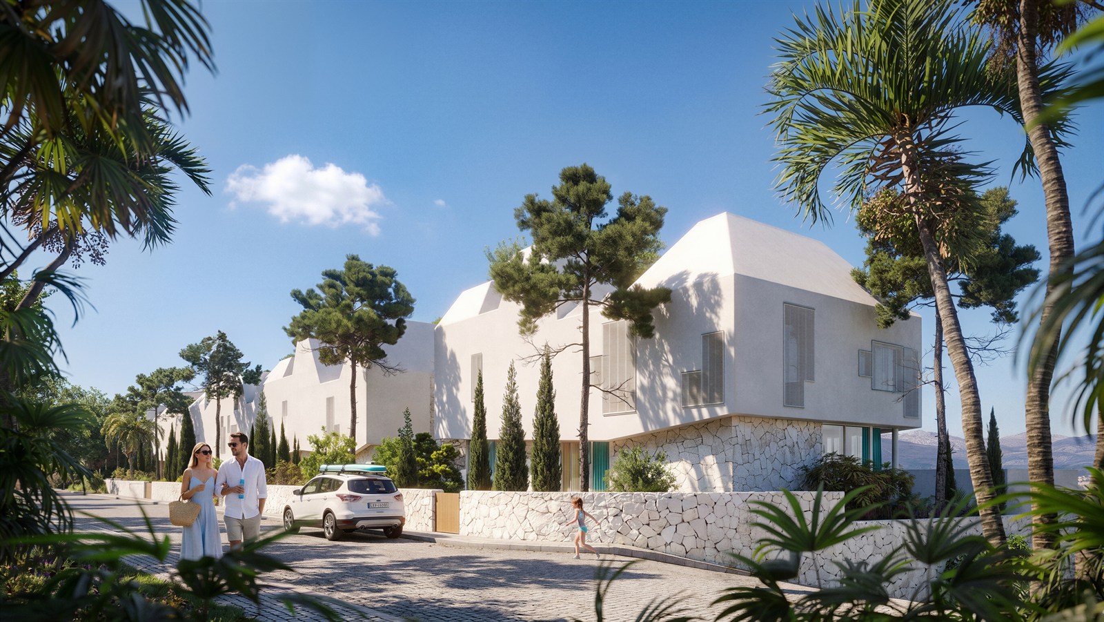 White gabled villas among palms and pines with a couple on the drive