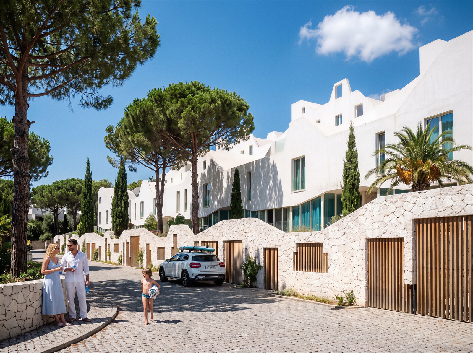 White villa street under umbrella pines with stone walls and cobbles